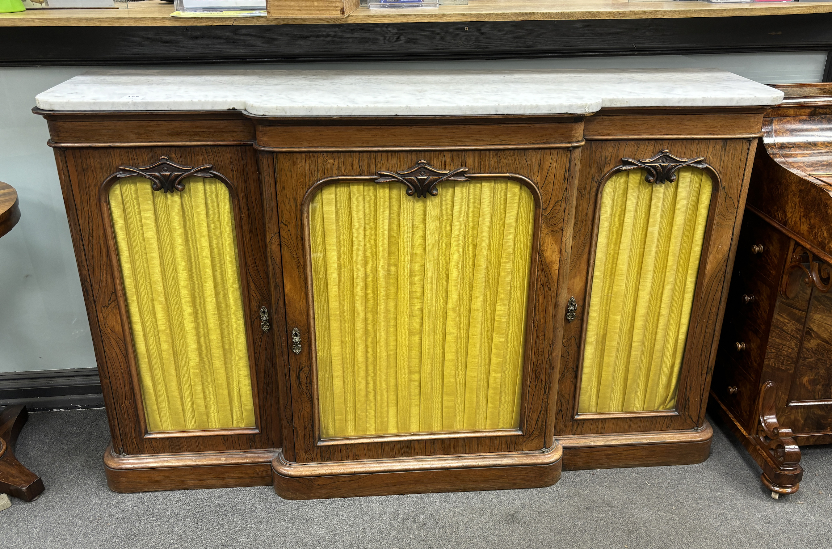 A Victorian marble topped rosewood breakfront bookcase, width 152cm, depth 42cm, height 168cm